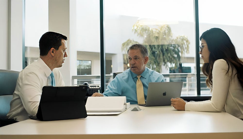 John W. Noland and Lee Previant help a client